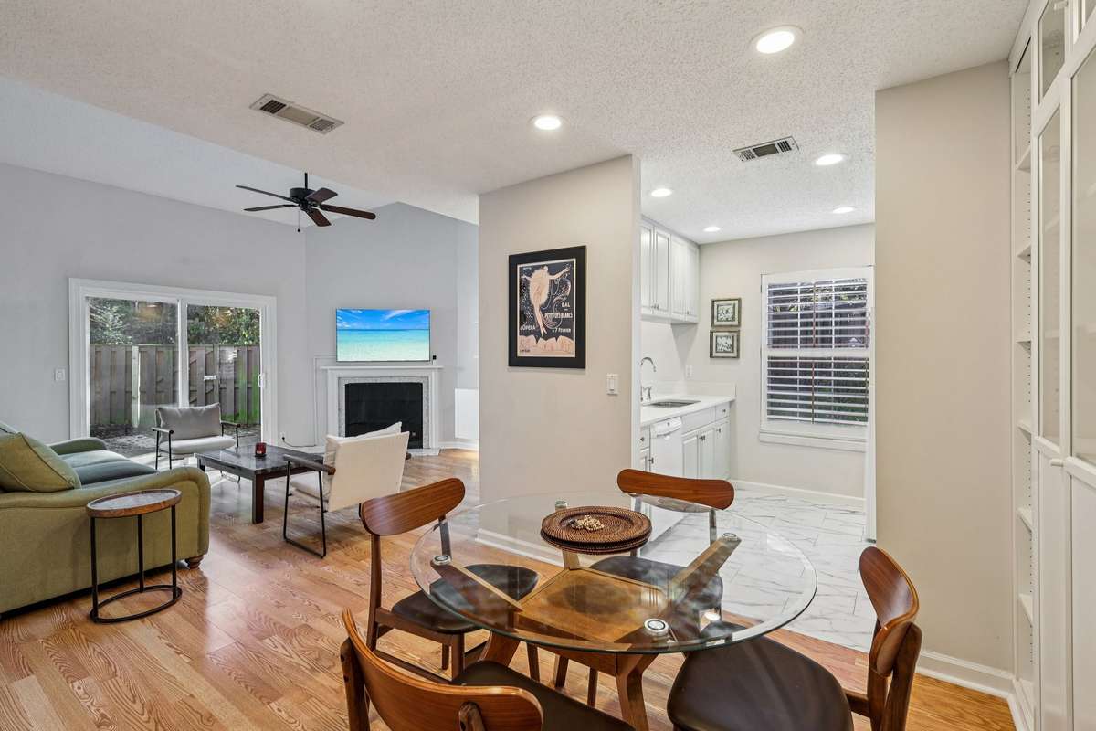 Vaulted ceilings, natural light, and easy flow to the patio make this room feel just right.