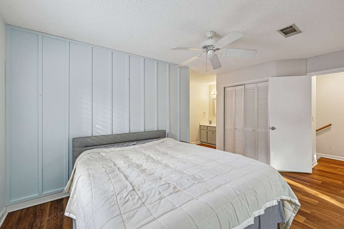Well-sized bedroom with built-in closet and vanity area, blending function with comfort.