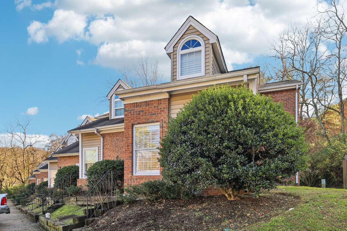 Full front elevation showcases the home’s timeless design perfectly situated in a quiet, established community.