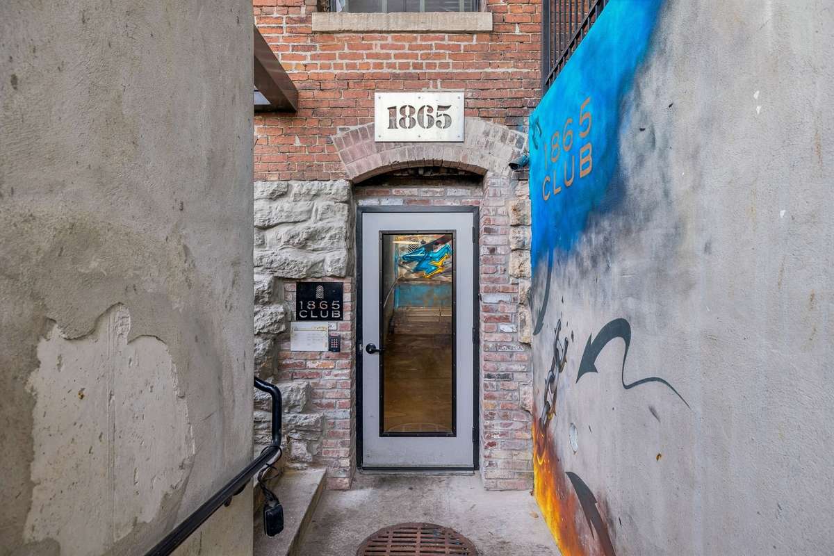 Door to basement with gym and Speakeasy.