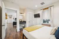 Bedroom with vanity and sink.