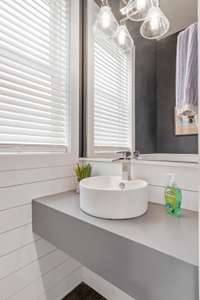 Powder room off the kitchen. Love the shiplap!
