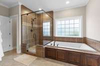 Newly retiled master shower and bath.