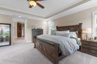 Master bedroom leads into the ensuite master bath with his and her walk-in closets on either side of the entryway.