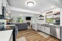 This beautifully refreshed open-concept layout blends modern kitchen finishes with a cozy living space, creating the perfect gathering spot for friends and family.