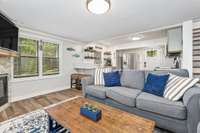 A seamless flow from the living room into the kitchen makes entertaining a breeze, complemented by coastal-inspired décor and stylish updates.