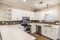 Virtual picture of what kitchen cabinets would look like painted white.