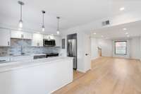 Open layout connects kitchen and living areas.