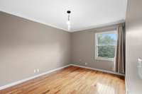 Cozy 2nd bedroom with neutral tones.