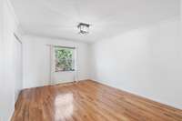 Hardwood floors in upstairs bedroom.