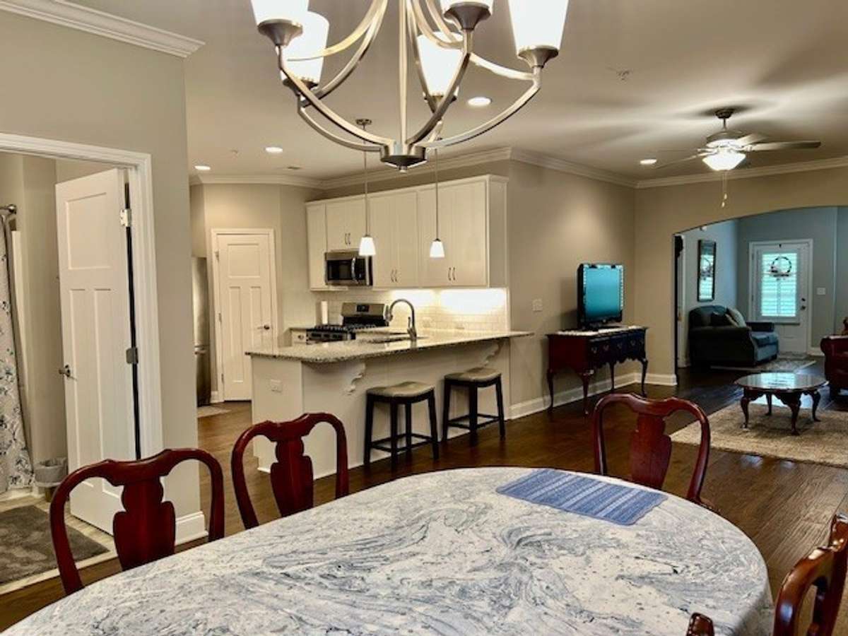 The long, granite countertop provides a great eat-in area in the kitchen and works perfectly with bar stools.