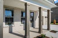Full covered front porch with cedar columns