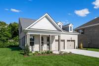 Brick on all 4 sides of the home + cedar beams and shutters