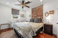 Second bedroom upstairs with queen bed and closet