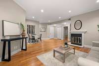 Updated wood flooring throughout + gas fireplace