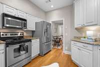 Updated white cabinets provide ample storage space