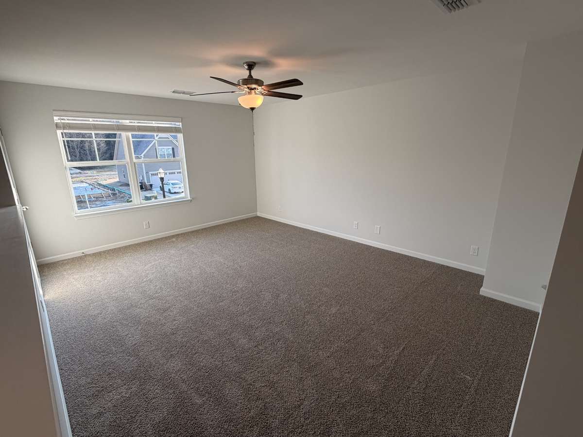 1/2 wall really opens the upstairs up and the double window allows for plenty of natural light!