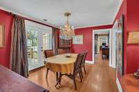 Formal dining room located adjacent to the kitchen.  The chandelier is sentimental to seller and will not remain with the home
