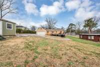 View of storage shed and back of home