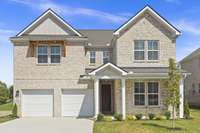 *Photo of actual home* 

This home features a full brick exterior for timeless curb appeal and added durability!