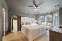 Stunning main-level primary bedroom with color-drenched walls in Iron Ore