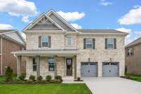 Beautiful brick exterior with cedar posts and shutters