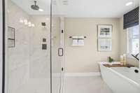 ***Photo taken from the Ashcroft model home in Lynwood Station***

A tiled walk-in shower with a rainfall shower head is included in the upstairs suite! A soaking tub is also included, perfect for unwinding after a long day.