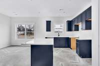 Open concept floor plan between the kitchen, dining room and living room