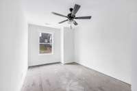 Bedroom two upstairs with ceiling fan