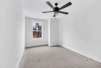 Third bedroom upstairs with ceiling fan