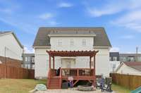 Love this spacious back deck and fire pit area