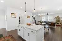 Hallway to primary bedroom features another coat closet