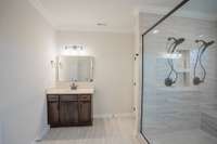 2 Separate Vanities and a Toilet Room!