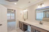 Double Vanity with Cosmetic Vanity in the Middle! Lots of Cabinet Storage, Modern Lighting and Large Mirrors!