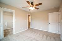 EXAMPLE>>>One of the Upstairs Guest Bedrooms, This One Features a Huge Walk-in Closet, Attic Storage and Private Access into a Full Bathroom!