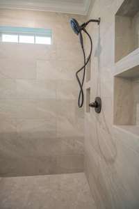 EXAMPLE>>>Fully Tiled Shower with a Bench Seat, a Top Window for Natural Light, Shelving Inserts and Glass Surrounding!