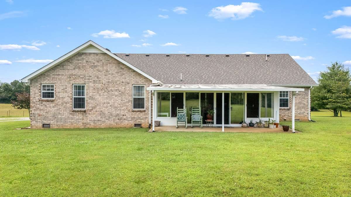 Another view of the back of the house with a covered patio