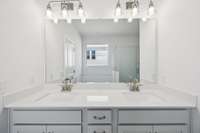 Double sinks with quartz countertops are included in the Owner's Bathroom.