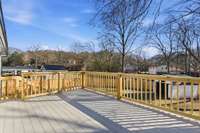 Brand-new Trex deck provides low-maintenance outdoor living for dining, relaxing, or hosting gatherings.