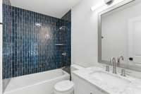 Each of the three bathrooms has been completely renovated, complementing the home’s three bedrooms with a cohesive, elevated design and like-new feel.