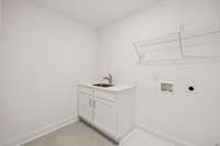 The Laundry Room is also located on the 2nd floor. We have added a sink in the room for added convenience as well.