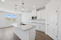 Bar stool seating is perfect for quick meals at the island.