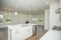 Photos displayed are of a model home. Actual options, finishes, colors, and selections may differ in the home being offered for sale.