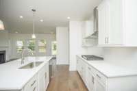 Photos displayed are of a model home. Actual options, finishes, colors, and selections may differ in the home being offered for sale.