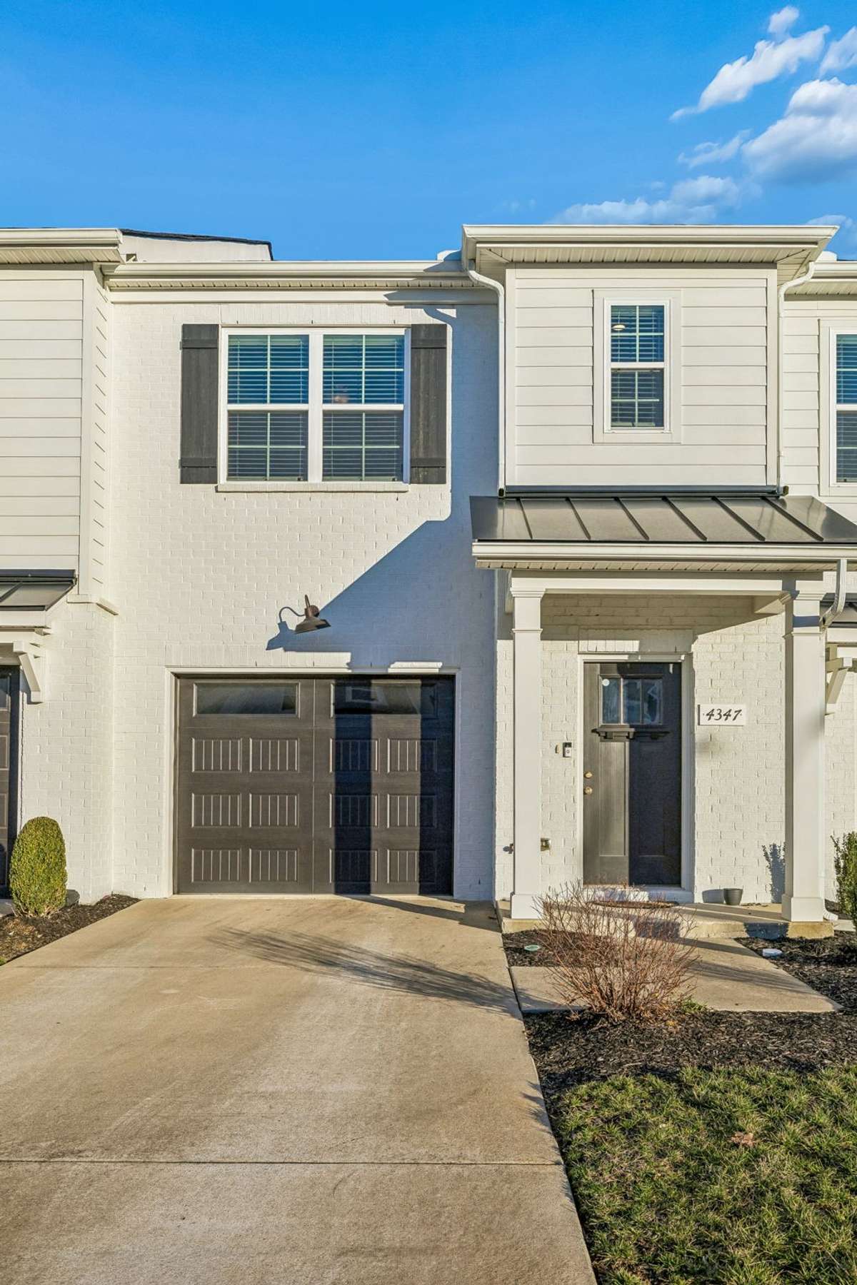The one car garage has epoxy flooring and there's plenty of room for additional parking in the driveway or in the guest parking spots located nearby.