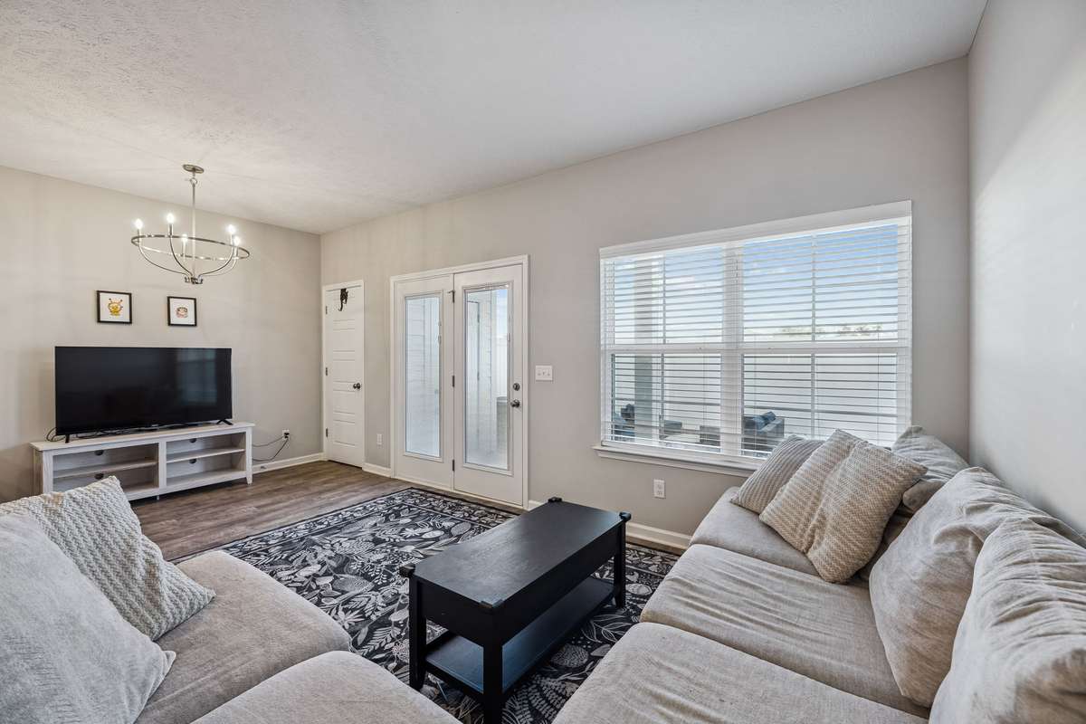 The living room has lots of natural light and is spacious enough for your furniture.  There is room for a kitchen table as well if you so desire.