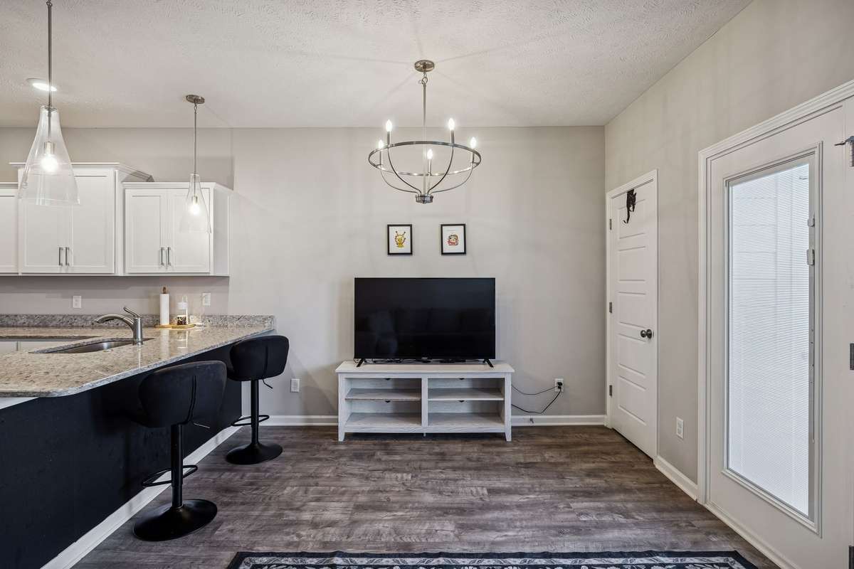 There is plenty of room for sitting and grabbing a snack at the the kitchen counter or, again, you can easily add a kitchen table in this area for larger group dining needs.