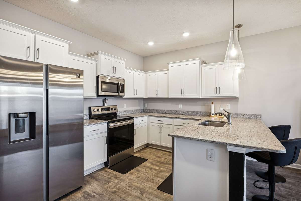 The kitchen refrigerator will convey with the home.