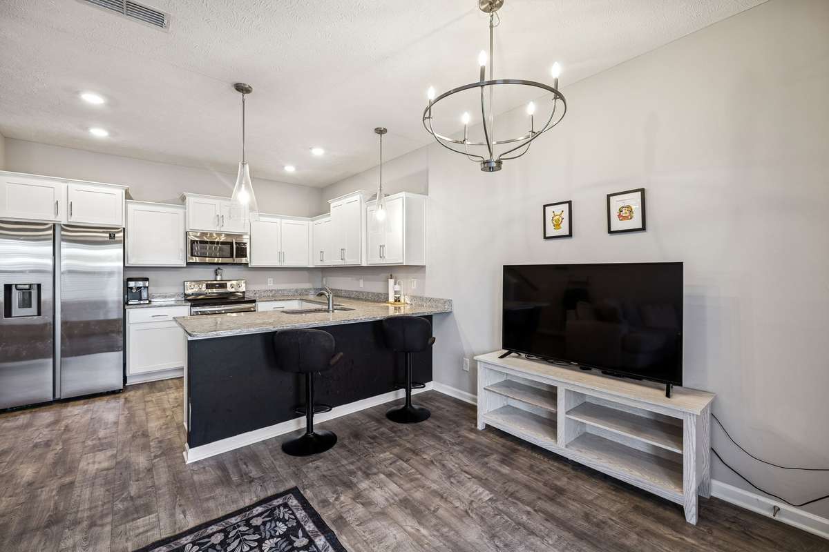 The open concept of the kitchen into the living room adds a more spacious feel to the space.