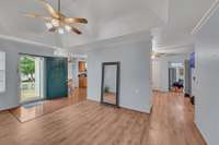 Look at this living room! Tray ceiling and beautiful hardwoods. Open floorplan allows you to see the cook and the dining area.
